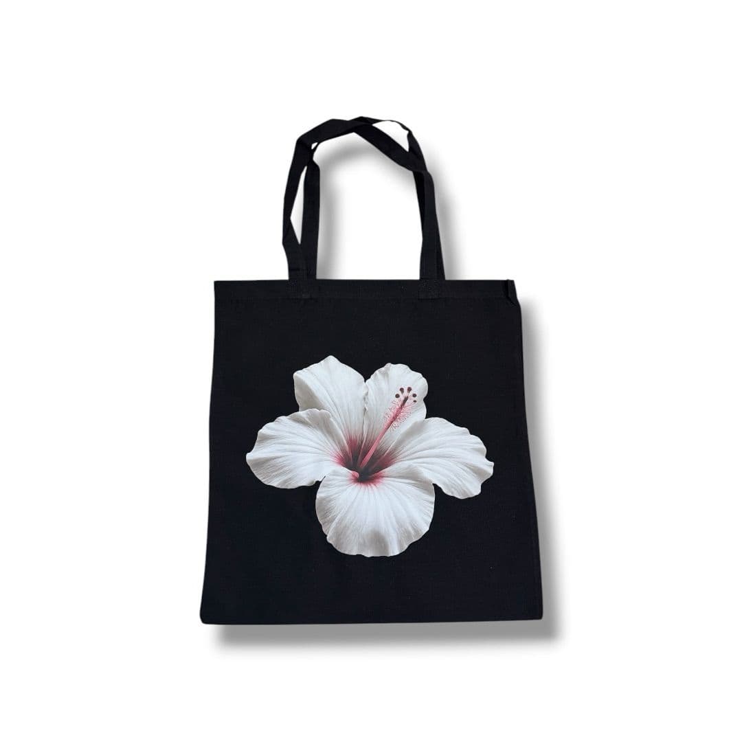 Black tote bag with a white hibiscus flower print